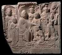 deep relief carving; Buddha at L seated on a throne with PL hand on head of kneeling Bodhisattva with clasped hands; 7 other figures stand behind and to R and L. Original from the Minneapolis Institute of Art.