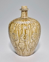 Rounded with flaring shoulder and narrow spout with flat protruding element below mouth; green glaze; decorated with stamped designs of circles, L-shapes and floral shapes. Original from the Minneapolis Institute of Art.