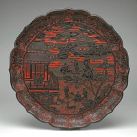 Barbed rim with foliate form; lobed sides on inner and outer rims carved with birds and flowers in black against a red ground; central area carved with two buildings in a landscape; deer and stork in lower foreground; 3 figures in a building at L; 8 figures at center, including a man on a horse and a man playing the flute. Original from the Minneapolis Institute of Art.