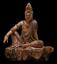 Seated figure, resting PR elbow on raised PR knee, PL leg bent and on ground and PL arm behind, hand resting on ground; wearing bracelets, long necklaces and elaborate crown. Original from the Minneapolis Institute of Art.