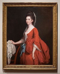 Portrait of a woman in red dress, cut low at the neck, with blue sash; white muslin veil falling from her hair; resting her right hand upon the back of a chair.. Original from the Minneapolis Institute of Art.