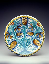 Title--tulip charger? Blue, yellow, green and brown floral design in basin with yellow and blue striping around rim; unadorned sides. Original from the Minneapolis Institute of Art.