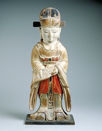 polychrome wood statue of a Confucian scholar standing, holding a book (?) downward at waist toward the viewer, wearing a long flowing blue robe, red waisted skirt with black belt and a black hat. Original from the Minneapolis Institute of Art.