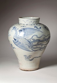 white jar with very narrow base and wide shoulder; two phoenixes among stylized clouds and flames rendered in blue; slightly irregular shape. Original from the Minneapolis Institute of Art.