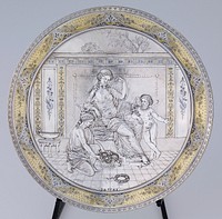 concave, plate-like shape; relief design of seated woman wearing a gauzy drape in an interior; putti with flowers wearing a necklace on PL side of woman; another figure places a basket of flowers at woman's feet. Original from the Minneapolis Institute of Art.