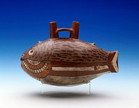 Pot in form of Fish with a double spout handle rising from the back. Slight modelling on head, tail, and fin area. Other features painted in grey, black, yellow, red and white. Broken at tail; cracked around head.. Original from the Minneapolis Institute of Art.