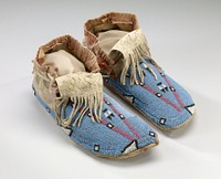 rawhide soles; tanned uppers; beaded geometric designs in pink, black and white on blue ground; fringed tongues; pink plaid cloth around ankles. Original from the Minneapolis Institute of Art.