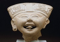 Smiling Face, ceramic, fragment of a larger figure, H. 5 in., W.7 in. Hollow head with open mouth and protruding tongue. Headdress with may symbols, ears with earplugs (one missing). Chips in headdress and two holes in back of head. Nopiloa. The object numbered 47.2.40 does not match the photograph on the Catalog card, although it is an extremely similar piece. See second Catalog card with same number 47.2.40. for other object. Wide face with sloping forehead, almond shaped eyes, and lips parted in an infectious smile. Small earplugs and turban-like headdress of which the central portion is broken away. Unglazed greyish clay.-original object-cat. card. Original from the Minneapolis Institute of Art.