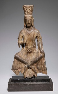 Figure of a Maitreya Buddha, porbably Avalokitesvara, seated as if on a stool, his legs crossed at the ankles, his body slightly bent forward, and his hands in the 'do not fear' attitude. The upper part of the body is partially covered with a scarf which falls over the upper arms in pointed cap sleeves and merges with the skirt drapery. The ribbon-like ends of the scarf are knotted in an x-form over the abdomen. The skirt hangs in flaring, rippled pleats over the legs, which are clearly visible under the drapery. The face is typical of the Wei style of Lung Men, with lips and nose firmly modelled, eyebrows falling to meet the lines of the nose, eyes set low beneath the brows, and lids cut in a narrow almond. The hair is parted in the center, and crowned with a square tiara with a figure of Amitabha in front. This figure comes from the Ping Yang cave at Lung Men.. Original from the Minneapolis Institute of Art.