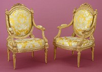 One of a set of four arm chairs (fauteuil) with flat sheild shaped backs in carved and gilded wood. Top of back decorated with carved oak leaves, garlands, ribbons, acanthus leaves, interlaces and laurel leaves. Legs with twisted grooves. Traces of old labels and cachets of red wax. Upholstery in yellow silk, blue and cream designs of cupids, animals,leaves and draperies.. Original from the Minneapolis Institute of Art.