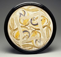 circular framed embroidery; four gold, blue and grey fish feeding on a patch of intertwining seaweed on a cream ground; was once a standing firescreen. Original from the Minneapolis Institute of Art.