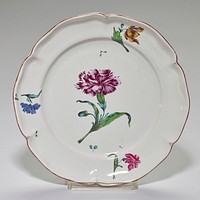 faience plate; rather deep, hexagonal-lobed shape; brown glaze on edge; center contains one large carnation painted in deep red-purple; leaves of carnation highlighted in pale coppery blue and shaded in dark green. Original from the Minneapolis Institute of Art.