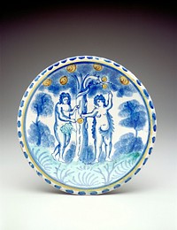 blue polychromed charger, image of Adam and Eve eating an apple from a tree entwined by a snake. Original from the Minneapolis Institute of Art.