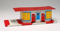 tin printed in service station design; 2 gas pumps and air hose on front; "WASHING" and "BATTERY" over black doorways on back; red tile roof; key taped on bottom. Original from the Minneapolis Institute of Art.