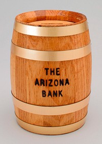 bank shaped as a barrel with brass bands; slit on top; "THE ARIZONA BANK" printed on front; plastic combination key on bottom. Original from the Minneapolis Institute of Art.