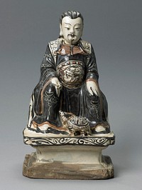 seated man wearing robes with Big Dipper on sleeves and dragon on belt; tortoise at man's feet; man has long dark hair and goatee; brown, cream and tan; T'zu-Chon ware. Original from the Minneapolis Institute of Art.