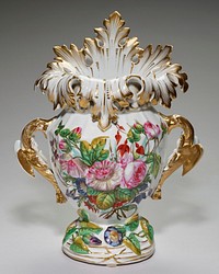 large ornate form; pair of winged animal handles; leaf-like mouth, raised in back; relief morning glories around foot; central painted floral spray featuring pink peonies and pink roses. Original from the Minneapolis Institute of Art.