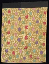 woven overall crysanthemum pattern on tan field in pink, red, green, purple, aqua; 9 1/2" addition on bottom; black cotton waistband. Original from the Minneapolis Institute of Art.