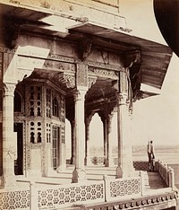 figure on a balcony of an elaborate building with geometric floral designs in tile and openwork; floral panels on inner wall, center. Original from the Minneapolis Institute of Art.