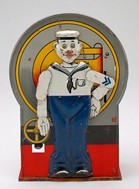 tin bank with standing sailor on front; sailor is wearing blue and white uniform with black shoes; lever on front causes sailor to raise PR arm in salute; on back is red tin box for coins. Original from the Minneapolis Institute of Art.