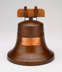 copper colored Liberty Bell with plaque on front: "Ring it Again/ The First National Bank/ Alexandria, Minn."; around top is printed: "Proclaim Liberty"...etc.; wood attachments. Original from the Minneapolis Institute of Art.