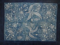 wide dark blue band surrounding lighter blue batik center in two panels; large floral, bird and insect patterns. Original from the Minneapolis Institute of Art.