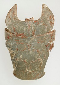 Monster animal mask with horns may identify as a bull-mask; double line incised details on only the front side. Grey-blue jade with calcification; traces of red pigment and clay-like substance.. Original from the Minneapolis Institute of Art.