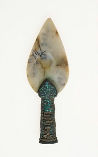 Bronze handle with inlays; no surface decor on the blade; T'ao t'ieh design on the handle. Grey-ivory jade with variation of brown and blue clouds; bronze patinated handle; hollowed handle, with green crystal-like inlay.. Original from the Minneapolis Institute of Art.