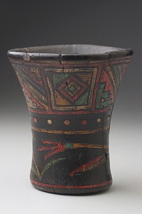 cup shape with flaring mouth; lightly incised decoration, painted in green, tan, orange and off-white; geometric and floral designs with man leading a pack animal and a woman following around mouth. Original from the Minneapolis Institute of Art.