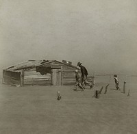 Farmer and sons walking in the face of a dust storm. Cimarron County, Oklahoma, USA