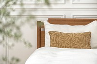 Cushion cover mockup psd on a bed