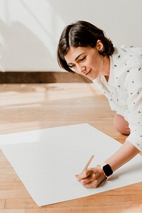 Happy woman writing on a white chart paper mockup