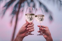 Couple enjoying glass of wine by the beach