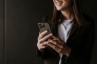 Businesswoman texting on her phone