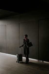 Businesswoman having phone call, business trip