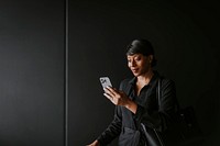 Woman using smartphone, business trip