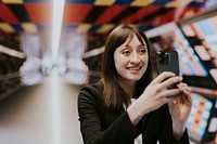 Woman taking photo with smartphone