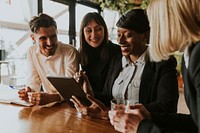 Business colleagues planning project on tablet