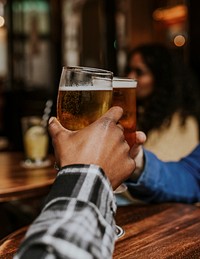 Friends toasting with beer, celebration photo