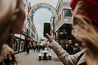 Woman taking photos with smartphone