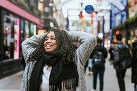 African American woman walking in city, outdoor photography