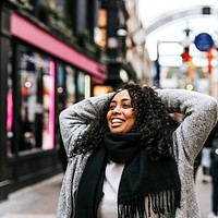 Cheerful woman walking in the city