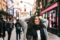 Cheerful woman walking in the city