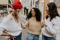 Happy girl friends hanging out in the city