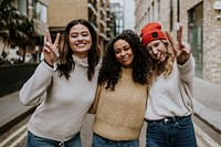 Happy girl friends hanging out in the city