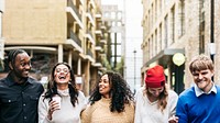 Diverse friends hanging out in city