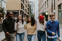 Diverse friends hanging out in city