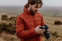 Photographer going through photos on camera