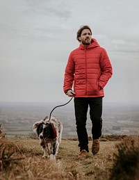 Puffer jacket mockup, man with dog psd