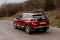 Back view of red car on hill road photo